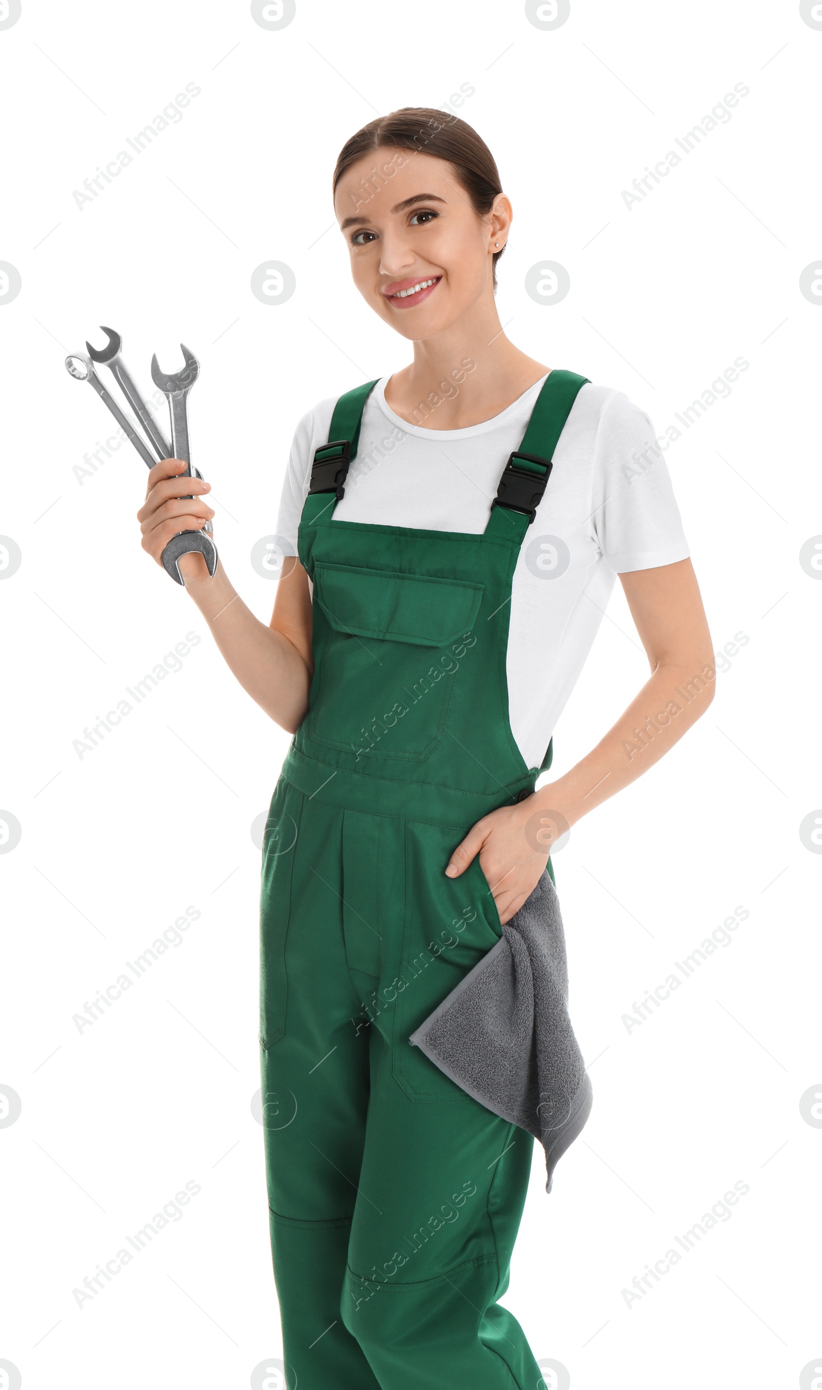 Photo of Portrait of professional auto mechanic with wrenches and rag on white background