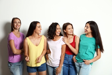 Photo of Happy women on white background. Girl power concept