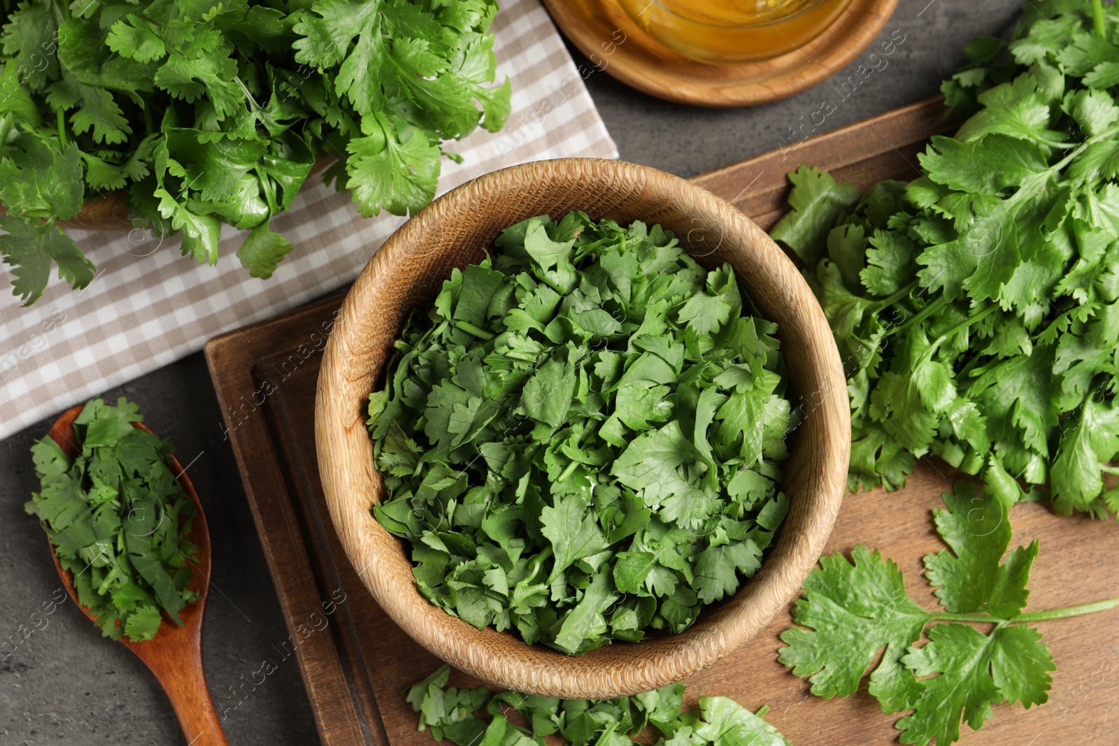 Photo of Fresh green cilantro on grey table, flat lay