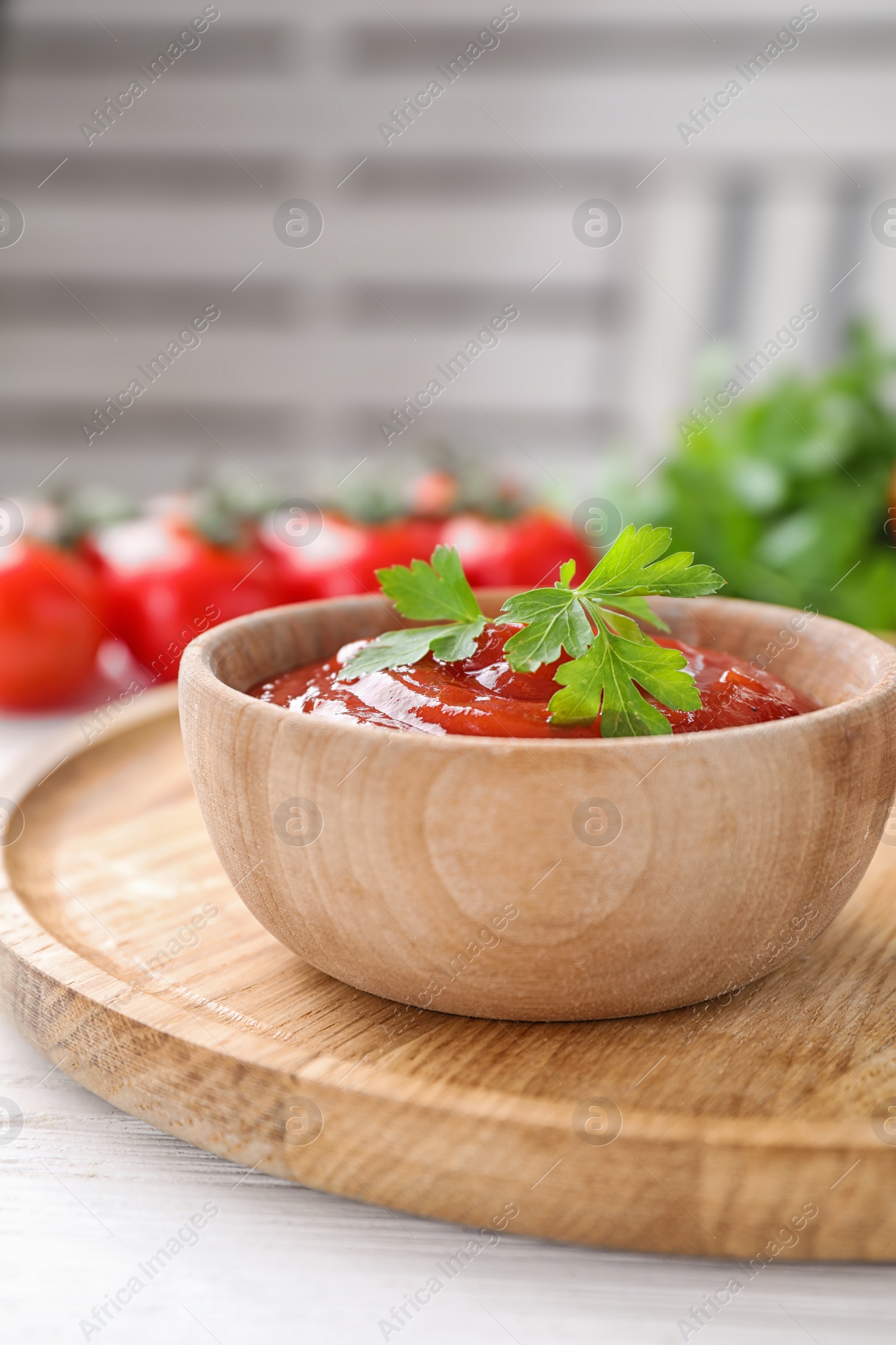 Photo of Delicious fresh tomato sauce with parsley on table