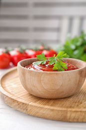 Photo of Delicious fresh tomato sauce with parsley on table