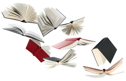 Image of Many hardcover books flying on white background
