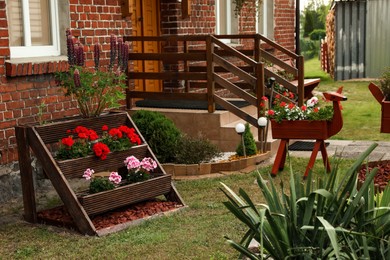 Photo of Beautiful backyard with blooming flowers and shrubs