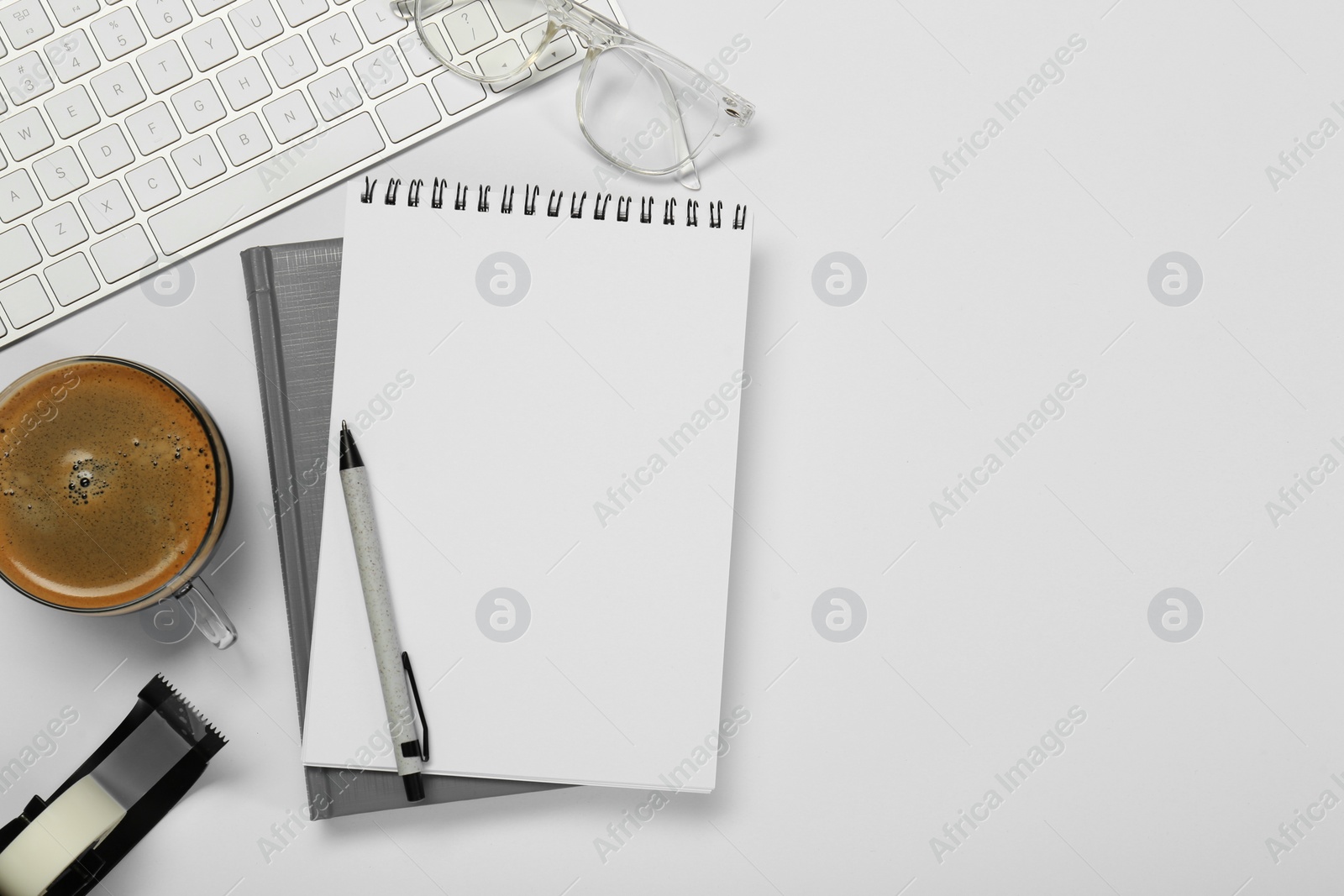 Photo of Flat lay composition with notebooks and coffee on white table. Space for text