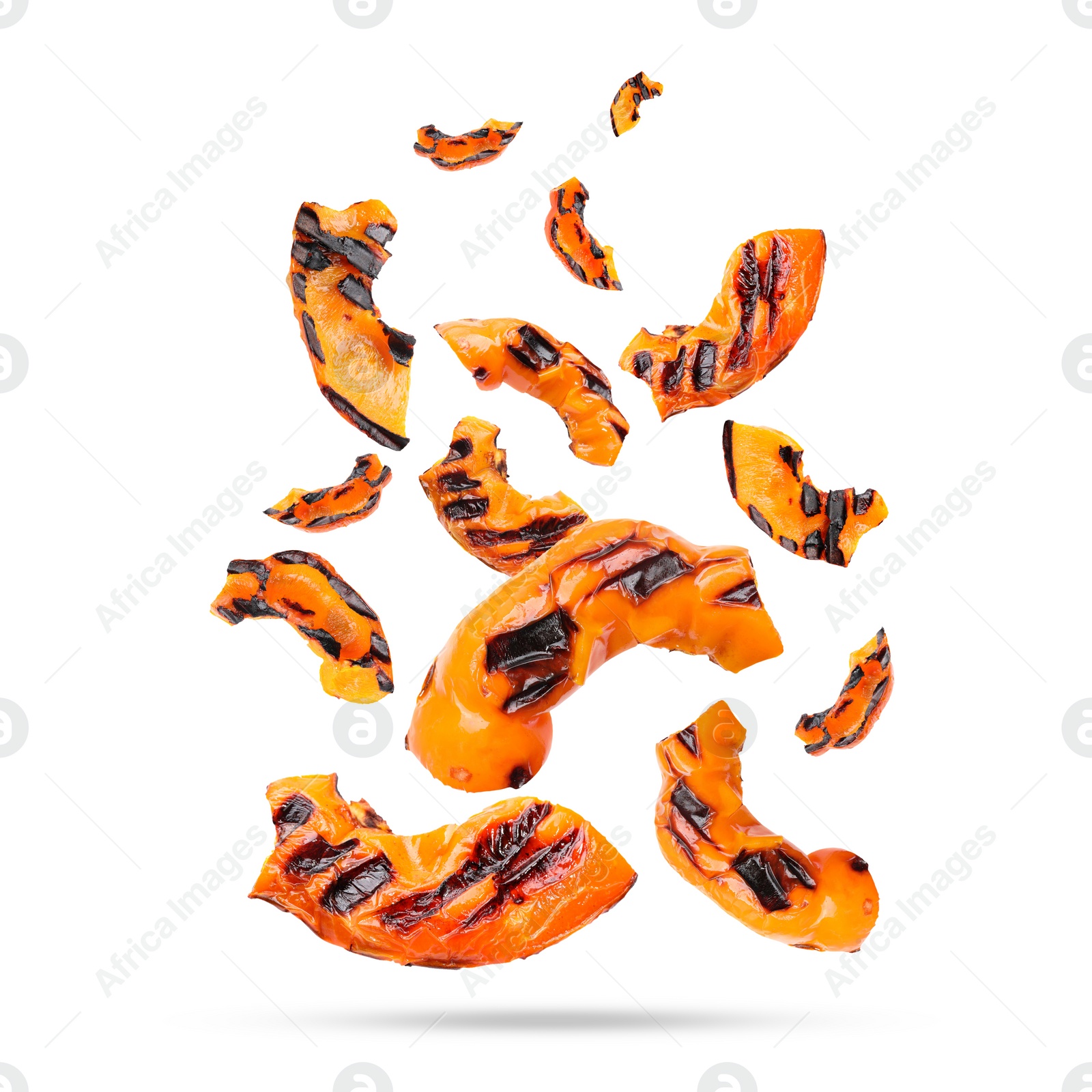 Image of Slices of grilled bell peppers in air on white background