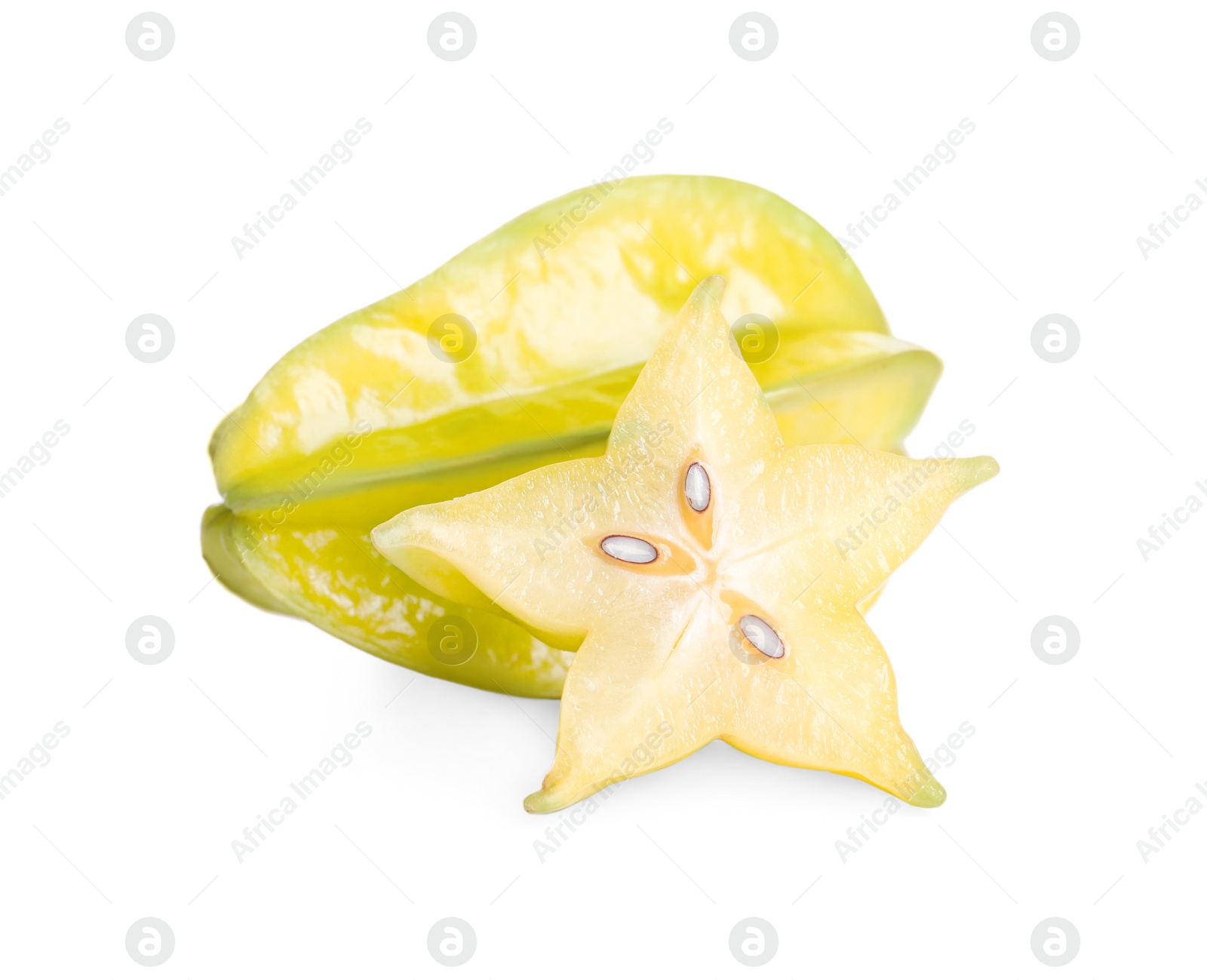 Photo of Cut and whole carambolas on white background