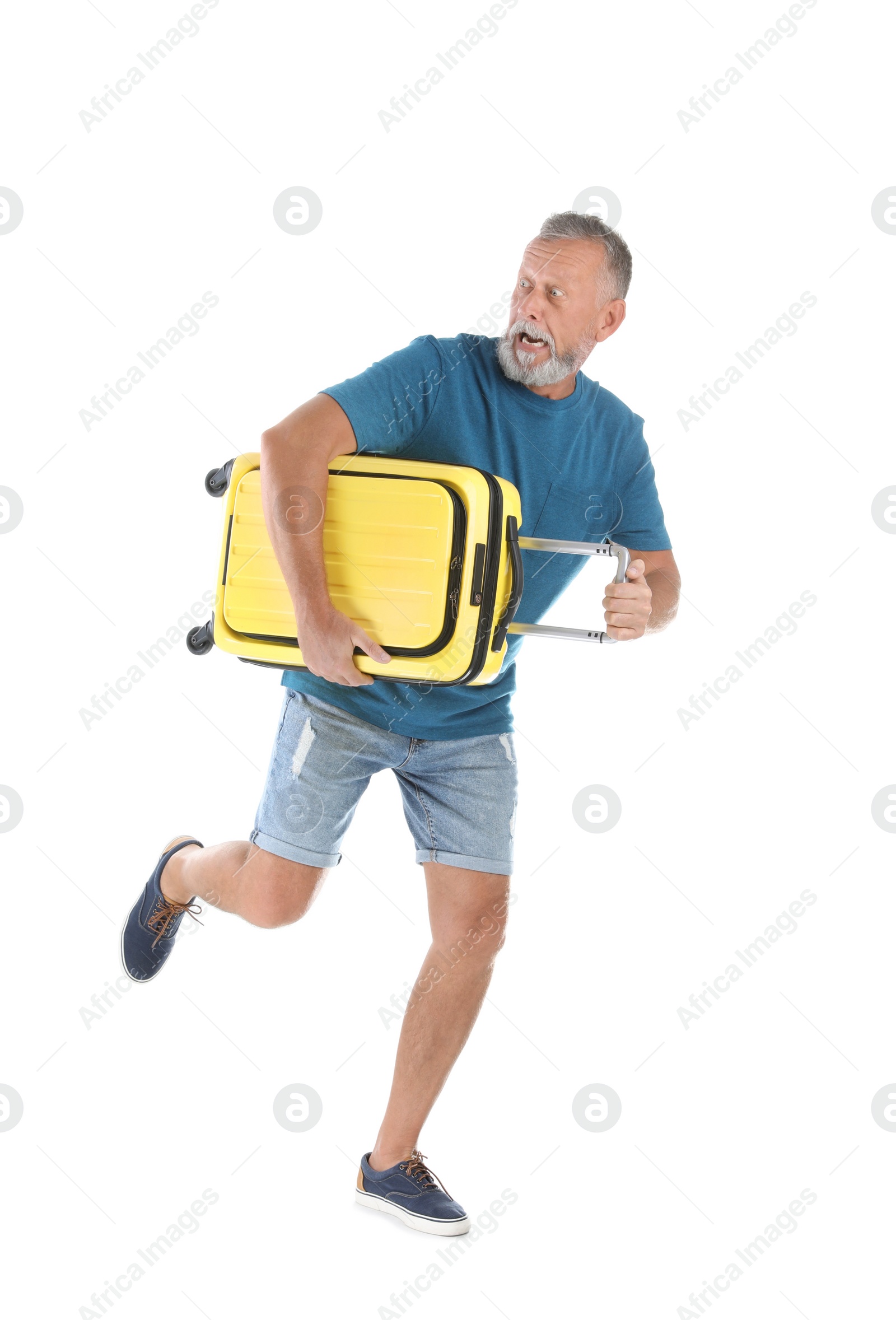 Photo of Senior man with suitcase running on white background. Vacation travel