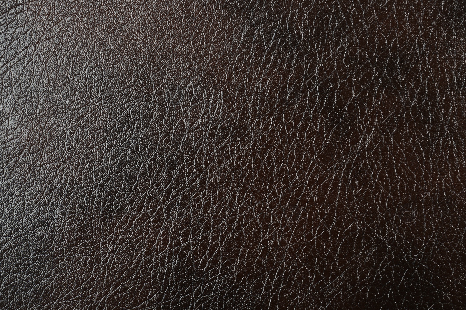 Photo of Texture of brown leather as background, top view