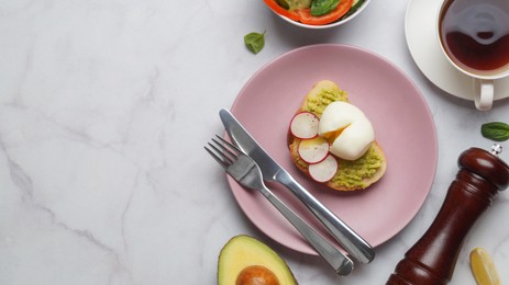 Delicious sandwich with boiled egg served on white marble table, flat lay. Space for text