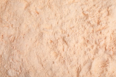 Photo of Pile of lentil flour as background, top view