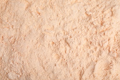 Pile of lentil flour as background, top view