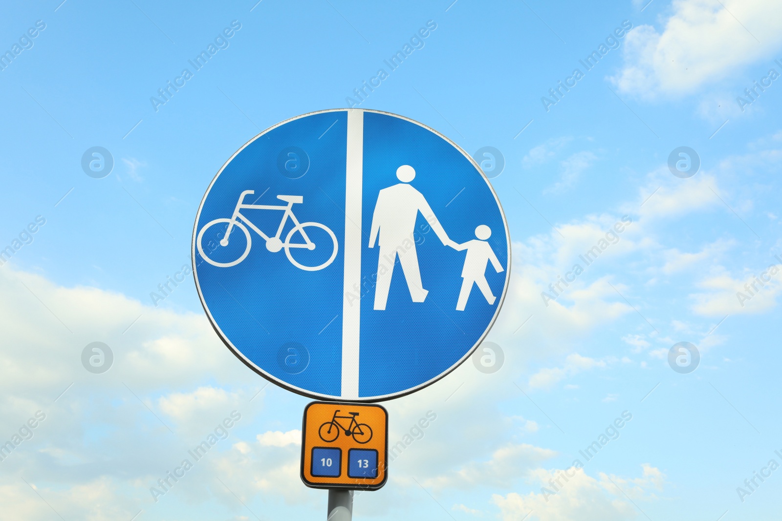 Photo of Traffic sign Compulsory Track For Pedestrians and Bicycles against blue sky