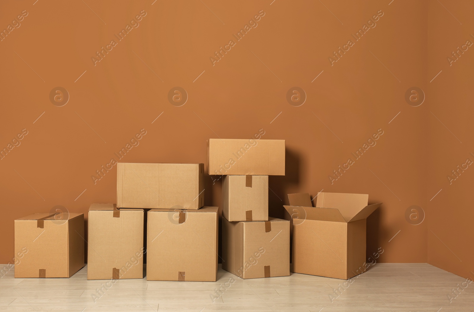 Photo of Cardboard boxes on floor indoors