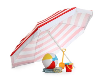 Photo of Beach umbrella, inflatable ball, towel and child's sand toys on white background