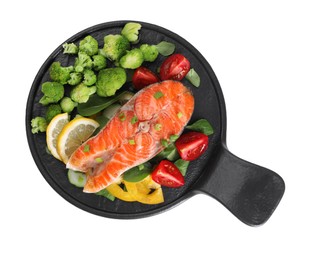 Photo of Healthy meal. Grilled salmon steak, green onion, lemon and vegetables isolated on white, top view