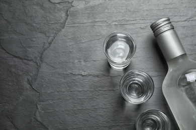 Photo of Cold Russian vodka on black table, flat lay. Space for text