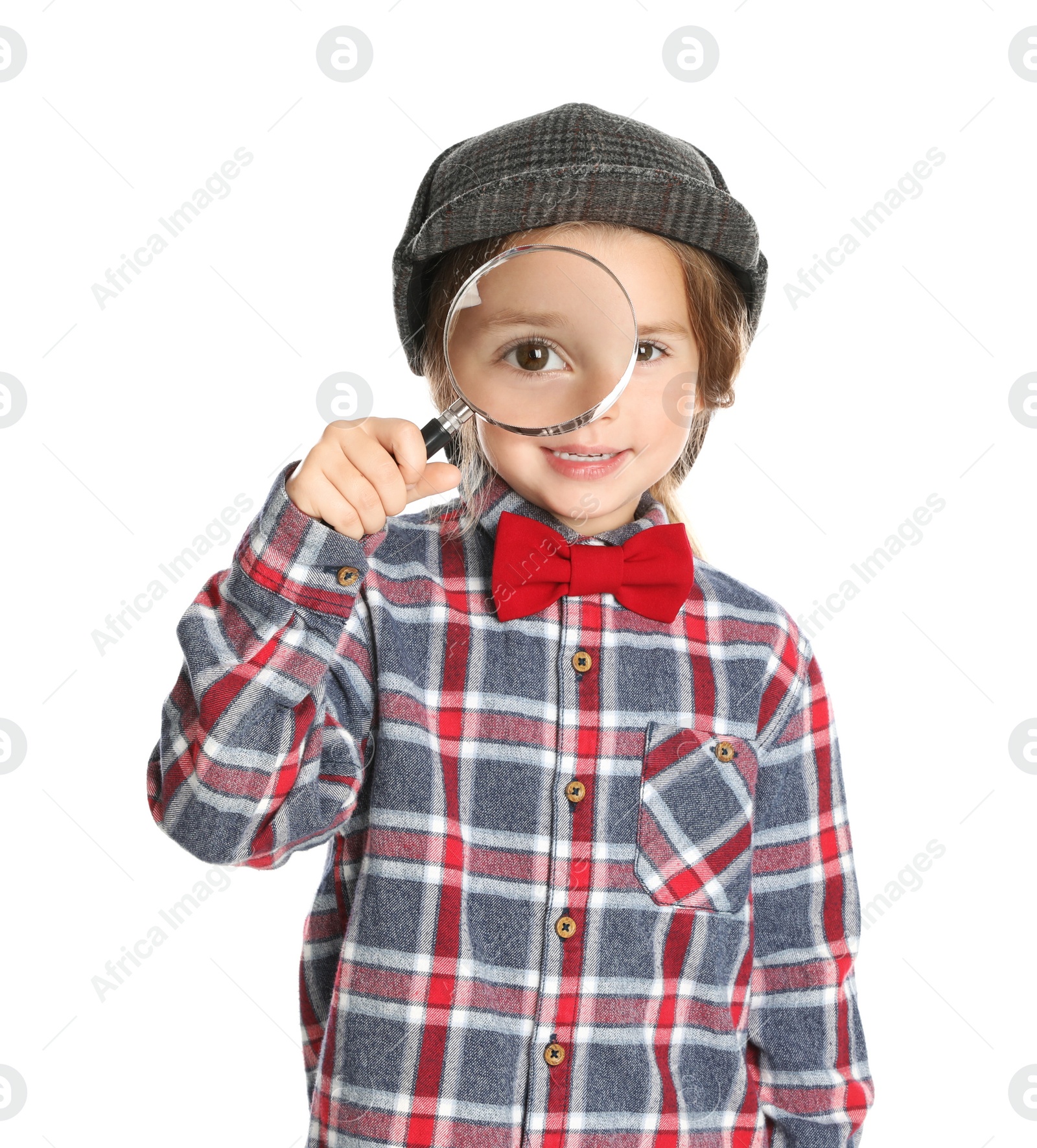 Photo of Cute little child in hat with magnifying glass playing detective on white background