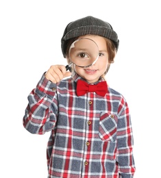 Cute little child in hat with magnifying glass playing detective on white background