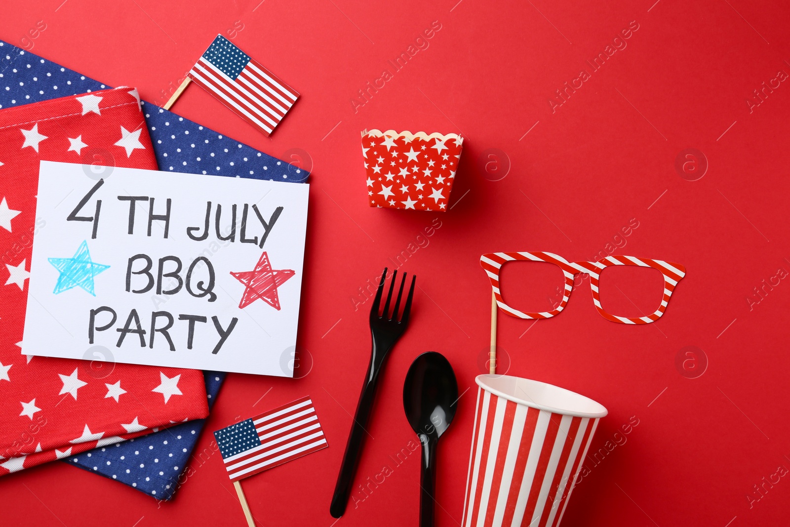 Photo of Flat lay composition with cutlery and card on color background. USA Independence Day