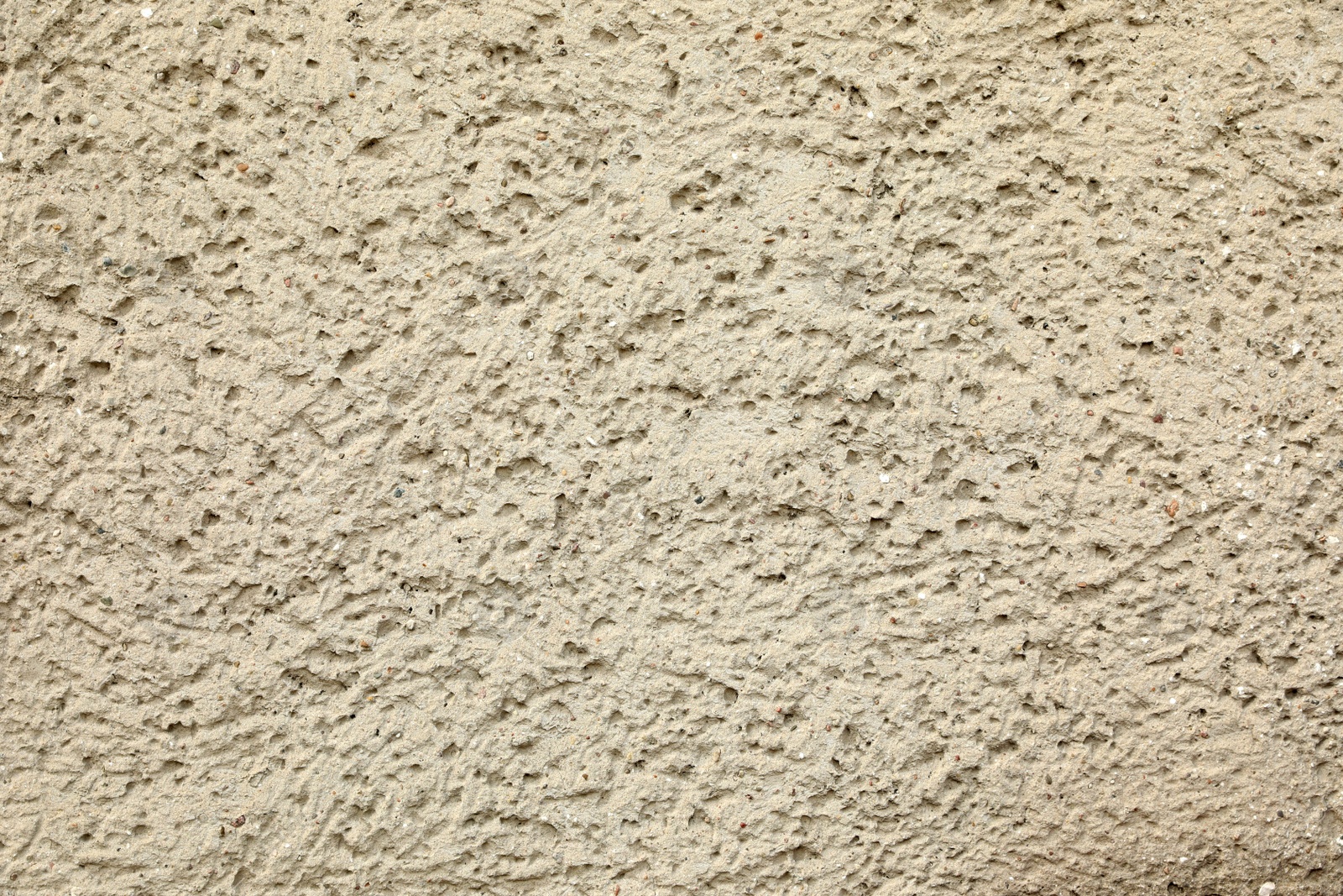 Photo of Texture of beige plaster wall as background