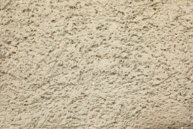 Texture of beige plaster wall as background