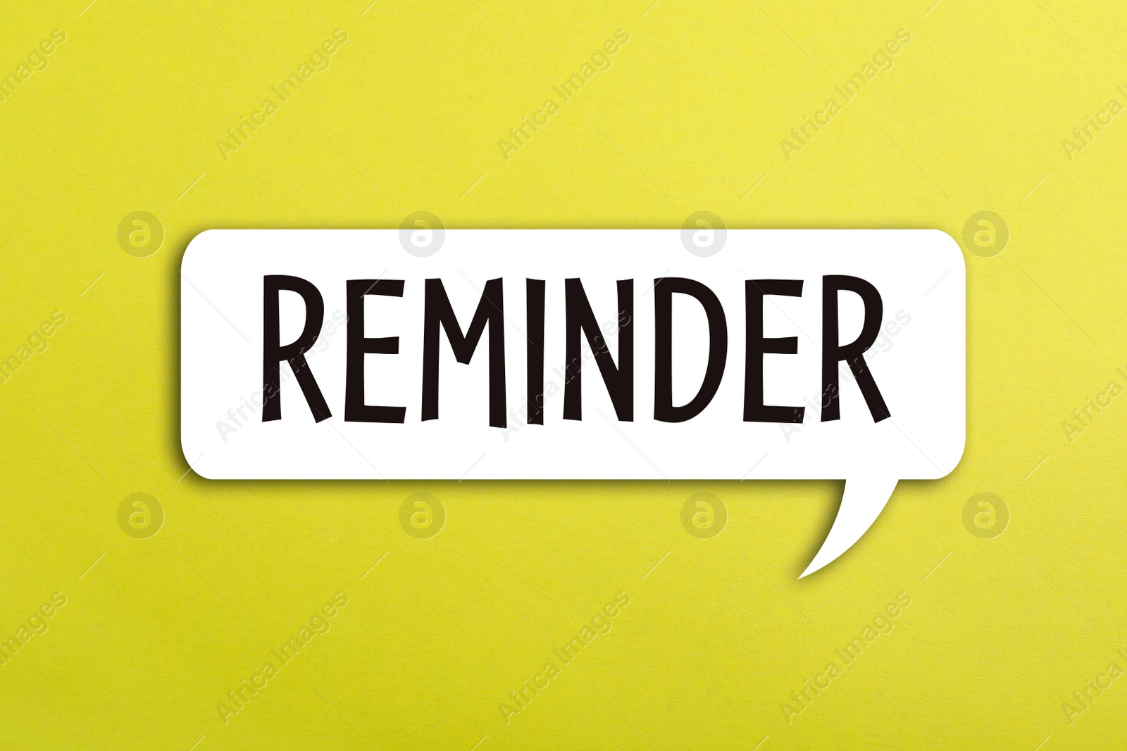 Image of Speech bubble with word REMINDER on yellow background, top view