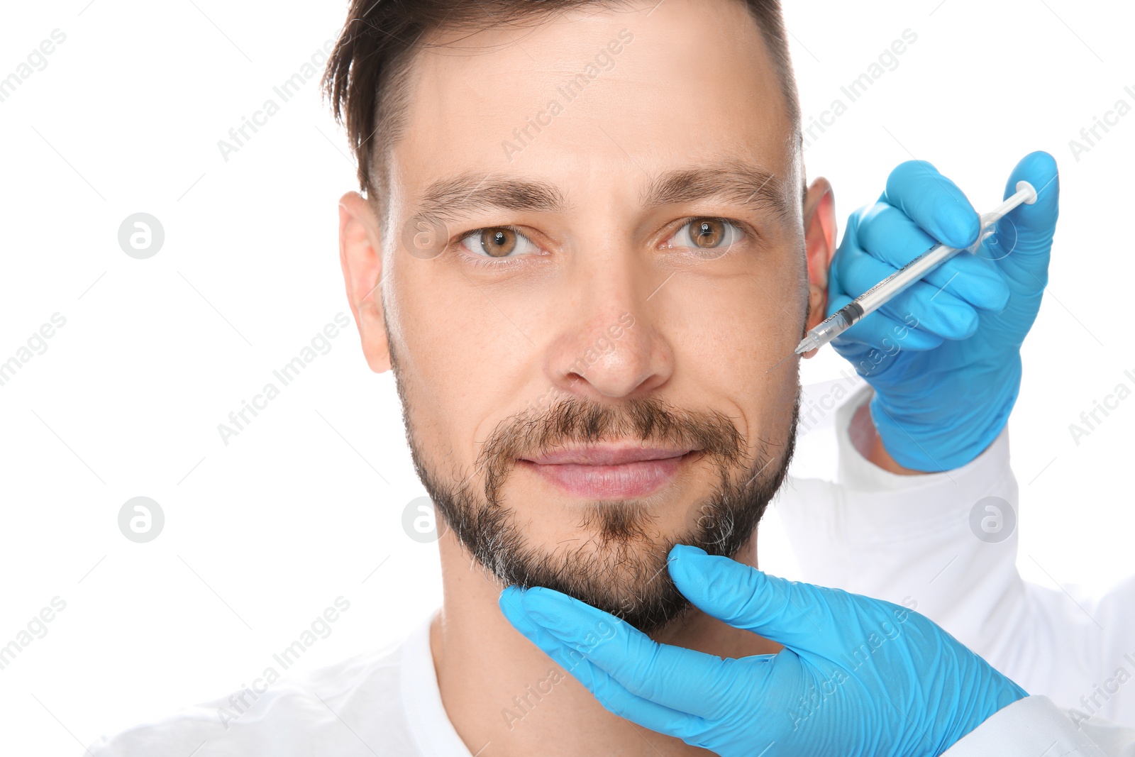 Photo of Mature man getting facial injection on white background. Cosmetic surgery concept