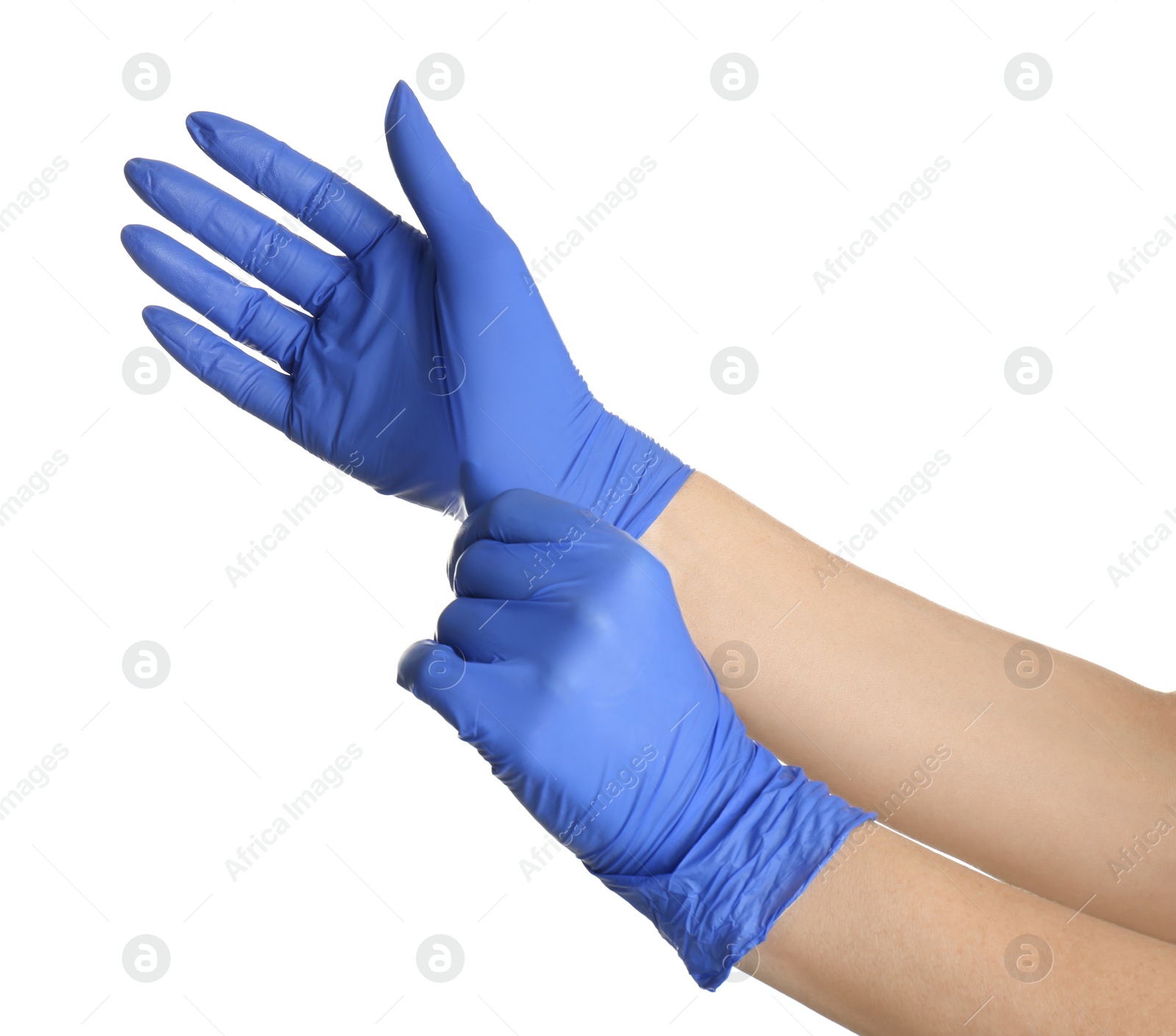 Photo of Woman putting on blue latex gloves against white background, closeup of hands