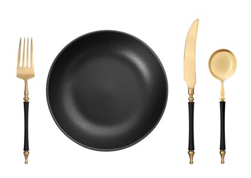 Image of Empty black plate with golden fork, knife and spoon on white background, top view