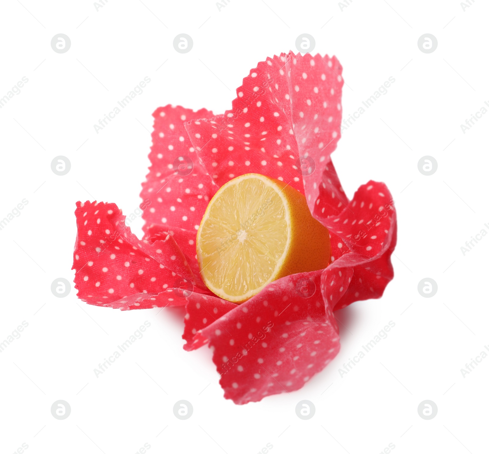 Photo of Half of lemon in red beeswax food wrap on white background