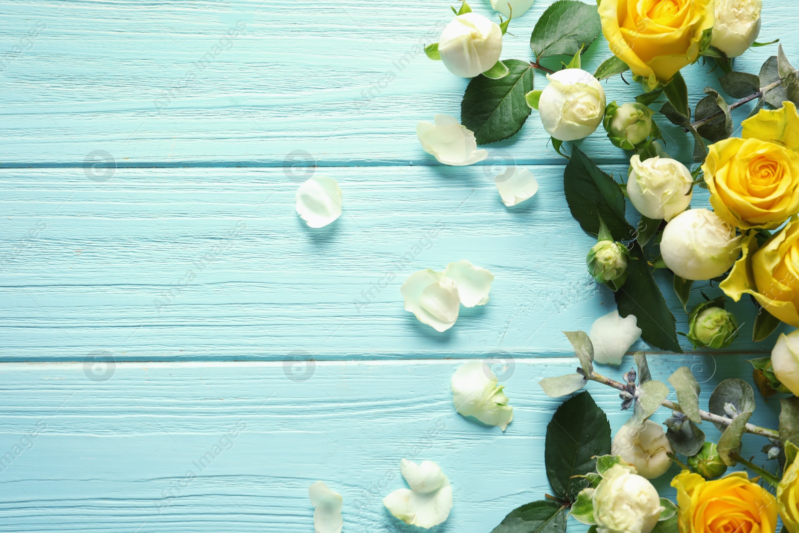 Photo of Flat lay composition with beautiful blooming flowers on wooden background