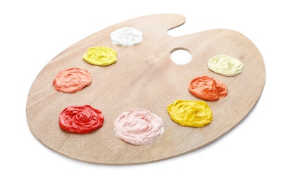 Palette with paints on white background