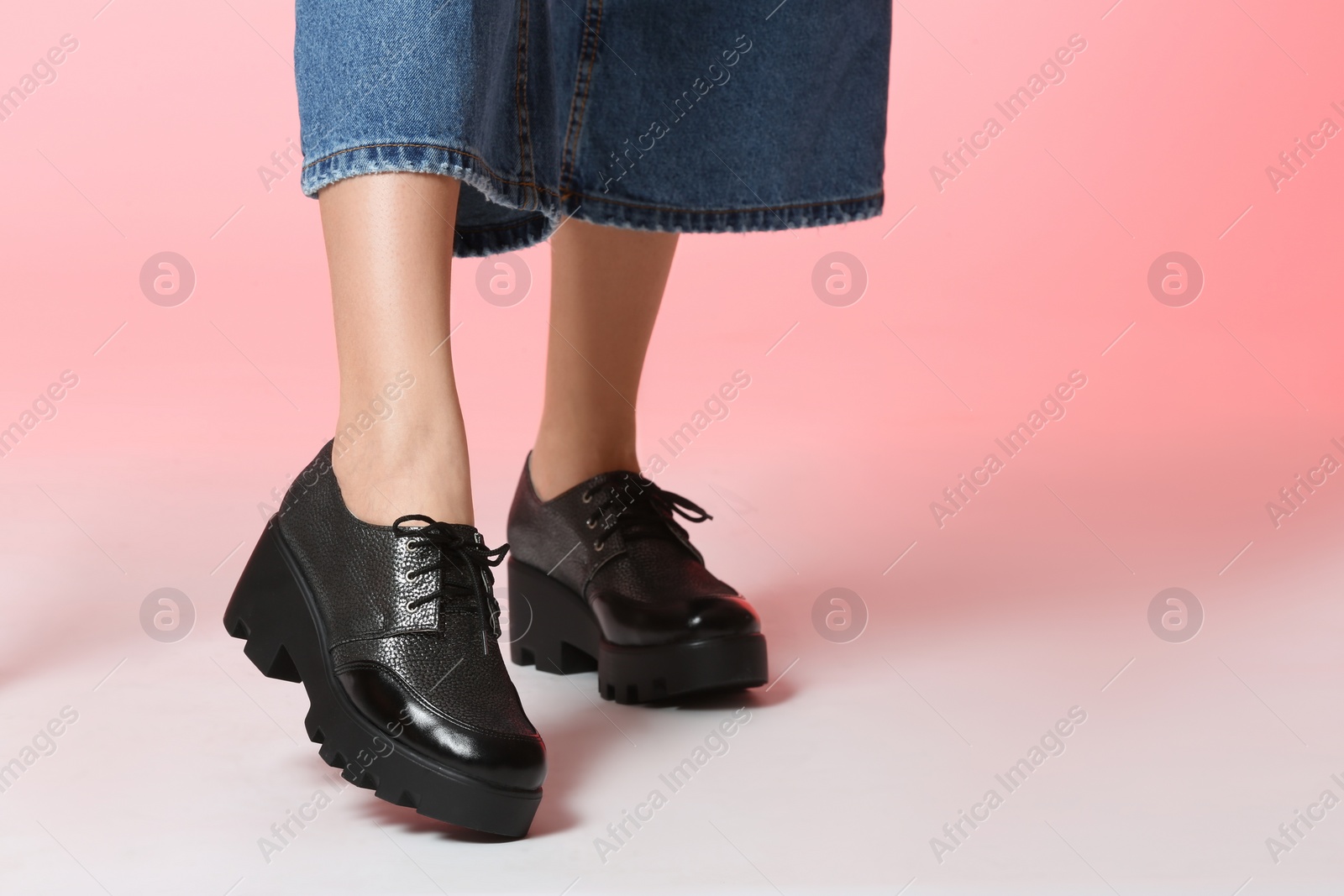 Photo of Woman in stylish shoes on color background, closeup. Space for text