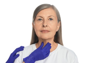 Photo of Endocrinologist examining thyroid gland of patient on white background, closeup
