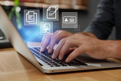 Image of Concept of electronic signature. Man working with laptop at wooden table, closeup