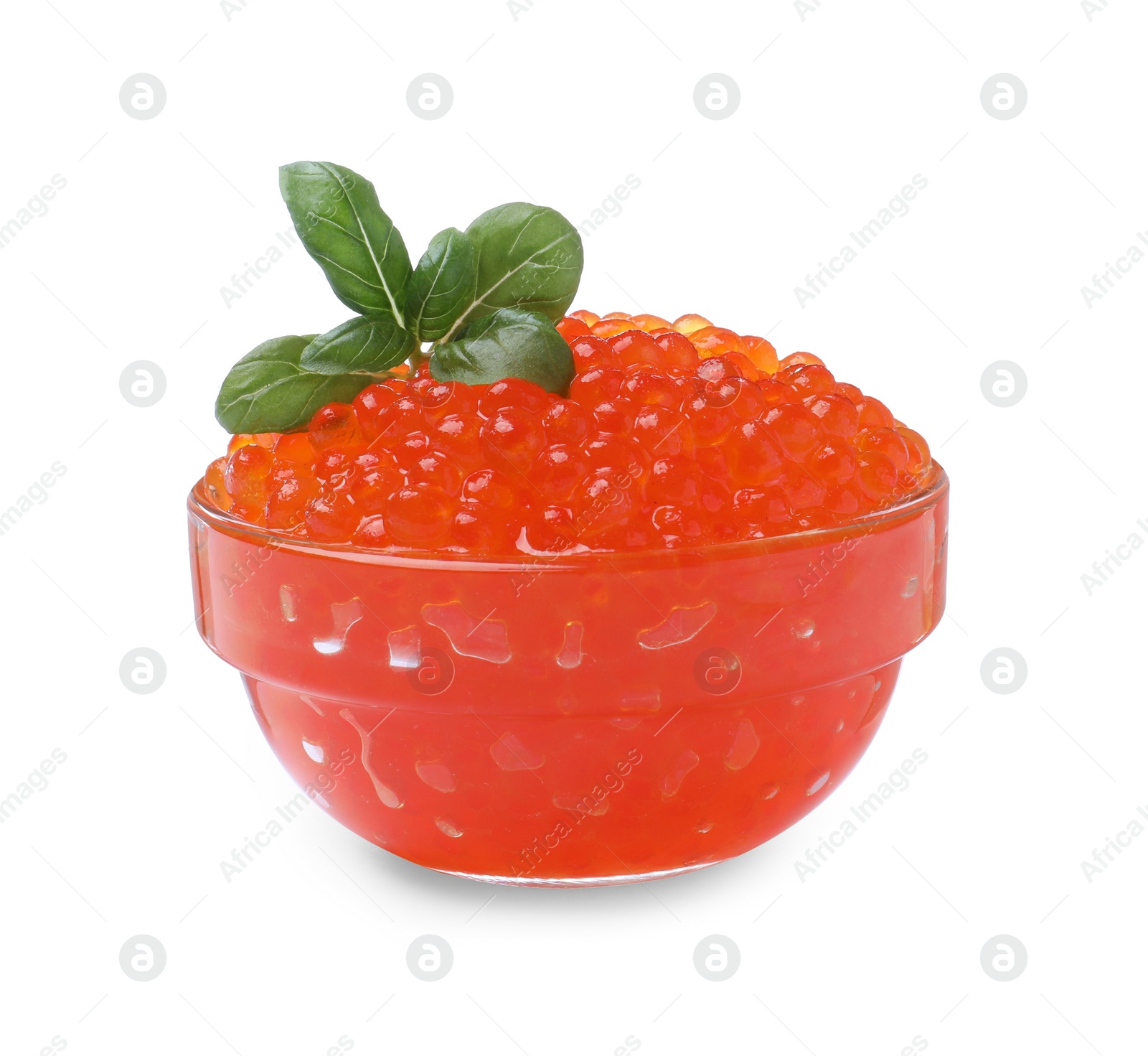 Photo of Bowl of delicious red caviar and basil isolated on white