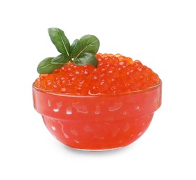 Photo of Bowl of delicious red caviar and basil isolated on white