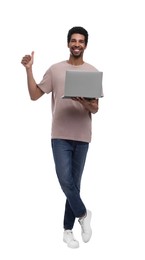 Happy man with laptop showing thumb up on white background