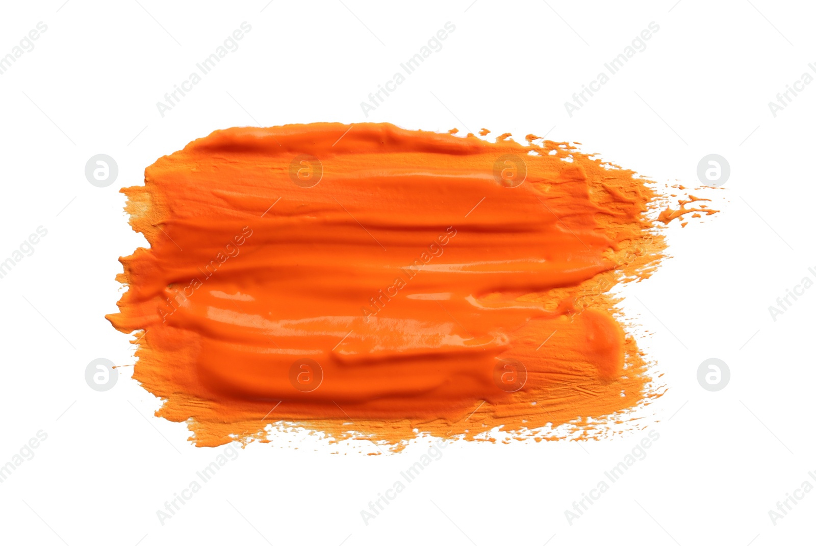 Photo of Abstract brushstroke of orange paint isolated on white