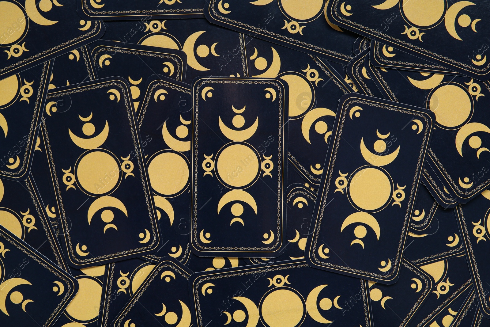 Photo of Tarot cards as background, top view. Reverse side
