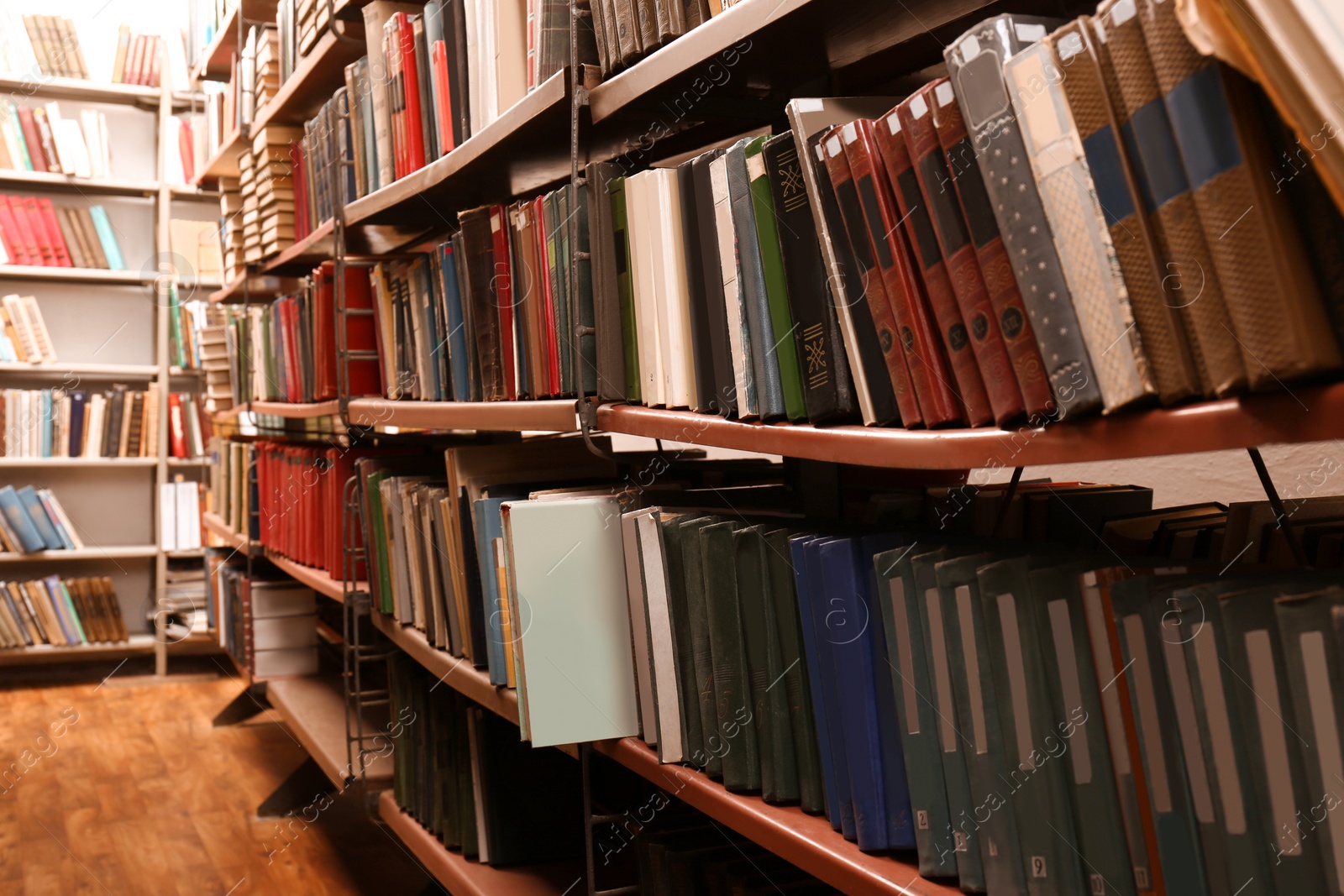 Image of Collection of different books on shelves in library