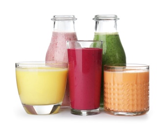 Glassware with delicious detox smoothies on white background