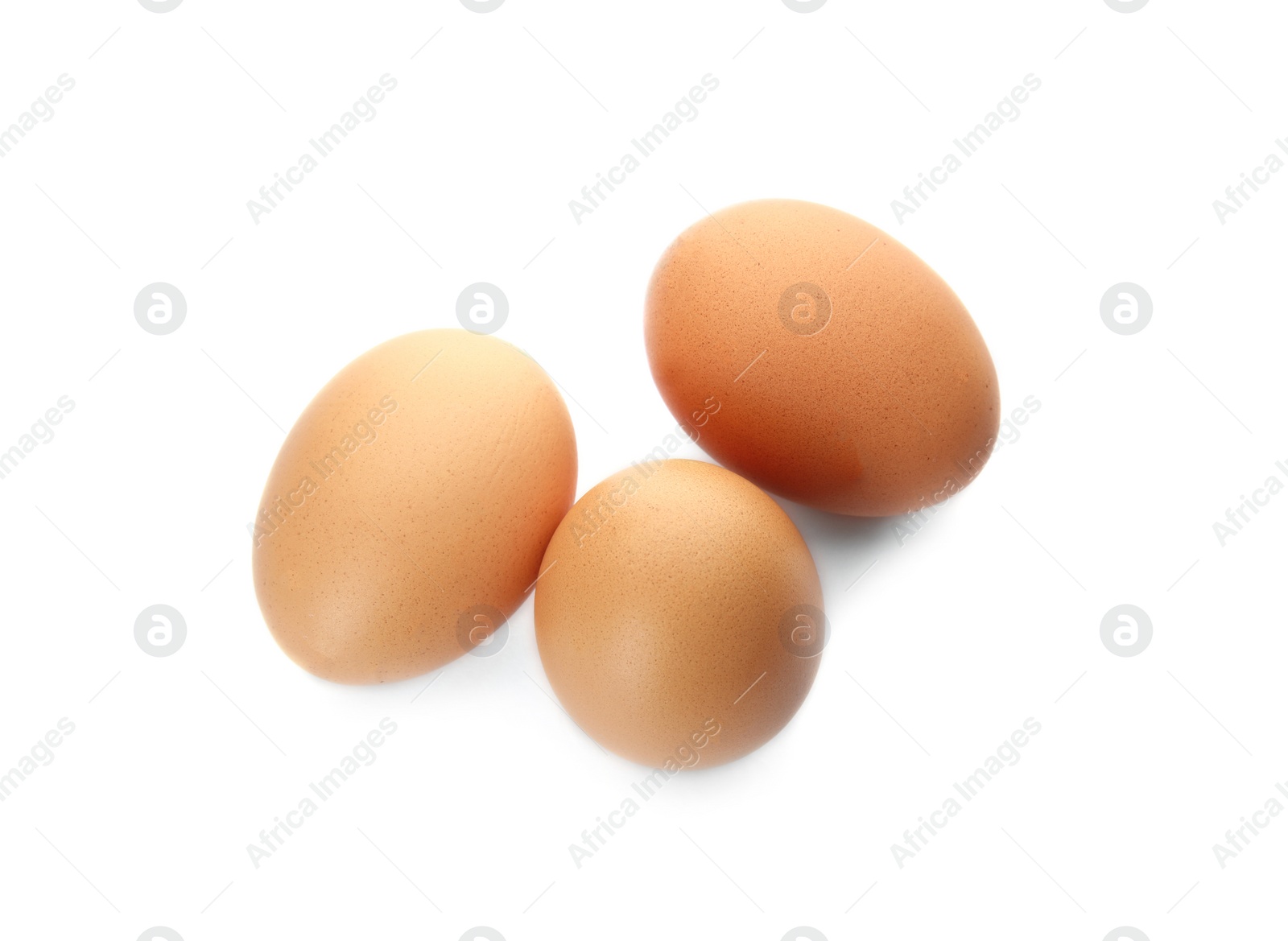 Photo of Few raw chicken eggs on white background