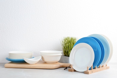 Set of dishware on table against white background