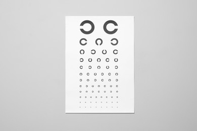 Photo of Vision test chart on gray background. Ophthalmic exam