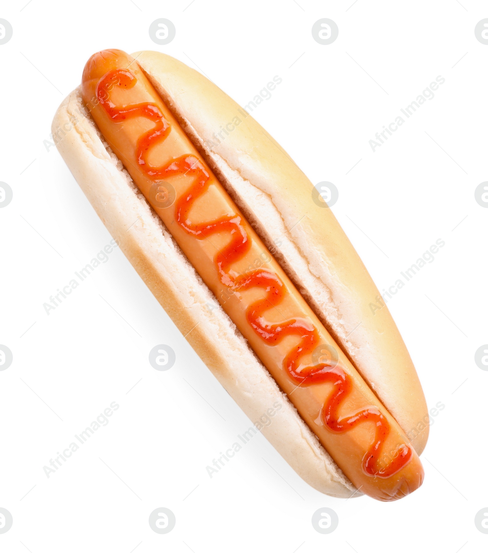 Photo of Yummy hot dog with ketchup isolated on white, top view