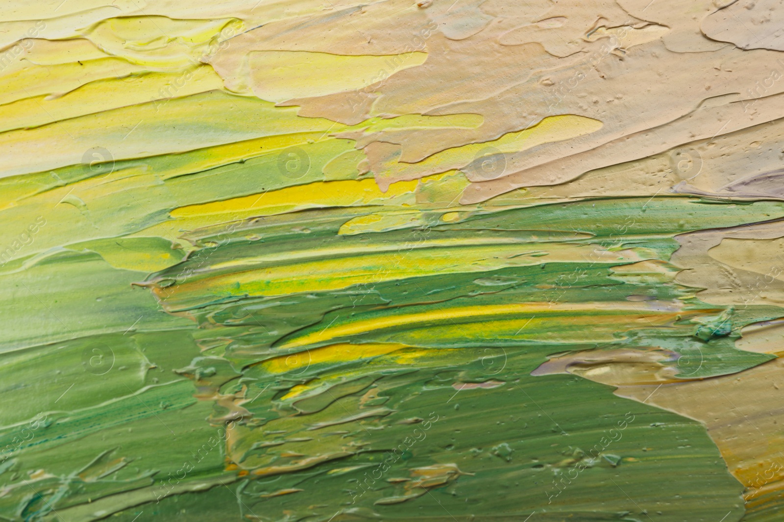 Photo of Beautiful strokes of colorful oil paints as background, closeup