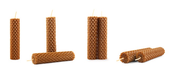 Set of beeswax candles on white background