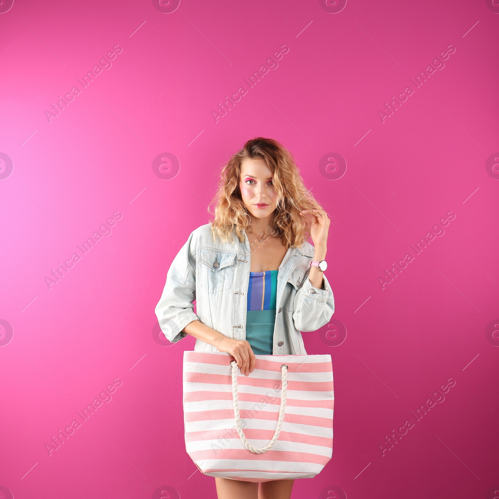 Photo of Beautiful young woman posing on color background. Summer fashion