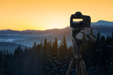 Image of Recording beautiful view of mountain landscape on professional video camera